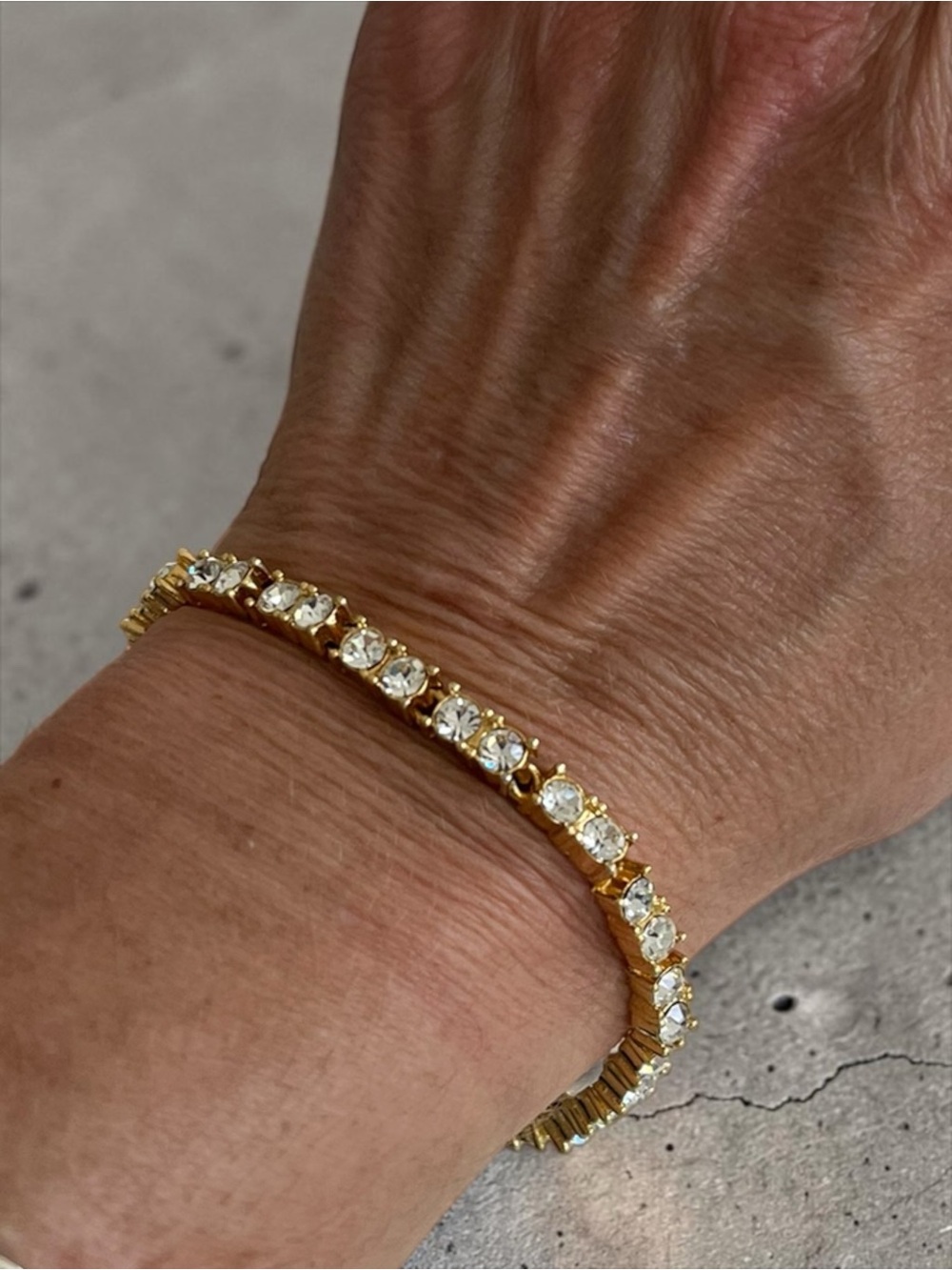 Napier Gold Tone Prong Set Rhinestone Tennis Bracelet